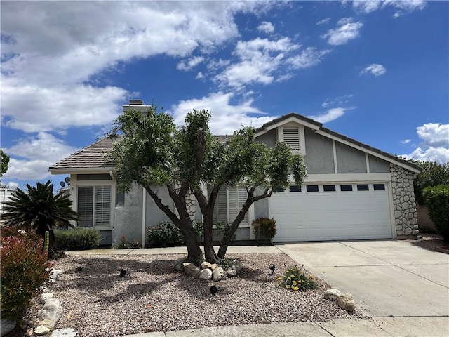 41023 Cedar Ridge Ln, Cherry Valley, CA 92223 - view of front of home featuring stucco siding, concrete driveway, a garage, a chimney, and a tiled roof