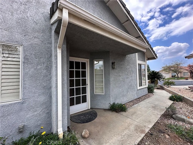 41023 Cedar Ridge Ln, Cherry Valley, CA 92223 - doorway to property with stucco siding and a patio