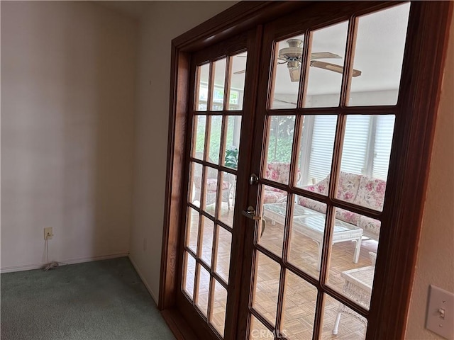 41023 Cedar Ridge Ln, Cherry Valley, CA 92223 - doorway with french doors, ceiling fan, carpet flooring, and baseboards