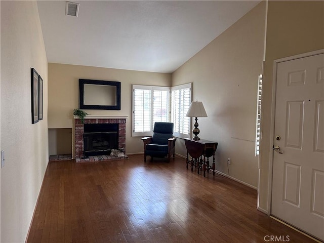 41023 Cedar Ridge Ln, Cherry Valley, CA 92223 - sitting room with lofted ceiling, wood finished floors, a fireplace, and baseboards