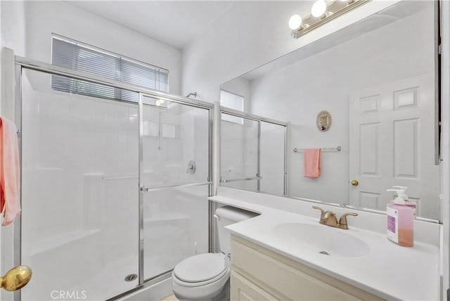 6981 Rivertrails Dr, Eastvale, CA 91752 - bathroom featuring a shower stall, toilet, and vanity