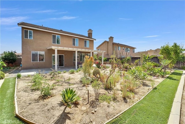 6981 Rivertrails Dr, Eastvale, CA 91752 - rear view of property featuring stucco siding, a patio area, and a fenced backyard