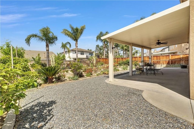 6981 Rivertrails Dr, Eastvale, CA 91752 - fenced backyard featuring ceiling fan and a patio area