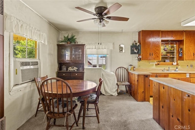 2831 Foothill Blvd, Oroville, CA 95966 - dining space featuring healthy amount of natural light, light carpet, a ceiling fan, and cooling unit