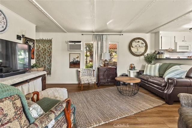 2831 Foothill Blvd, Oroville, CA 95966 - living room featuring a wall unit AC, wood finished floors, and baseboards