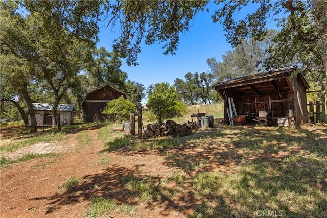 2831 Foothill Blvd, Oroville, CA 95966 - view of yard with an outbuilding and fence
