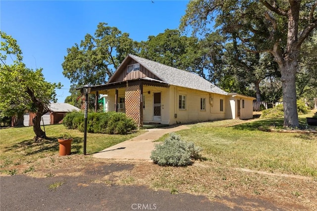 2831 Foothill Blvd, Oroville, CA 95966 - view of front of home featuring a front lawn and board and batten siding