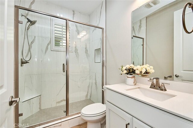 223 Gaspar, Irvine, CA 92618 - bathroom featuring toilet, a marble finish shower, and vanity