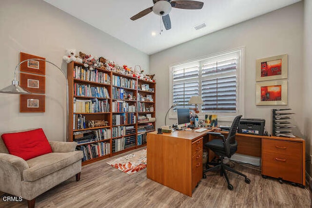 office space with wood finished floors and ceiling fan