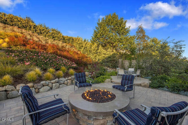 view of patio featuring an outdoor fire pit