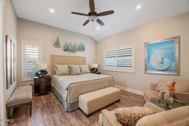 bedroom with multiple windows, wood finished floors, baseboards, recessed lighting, and a ceiling fan