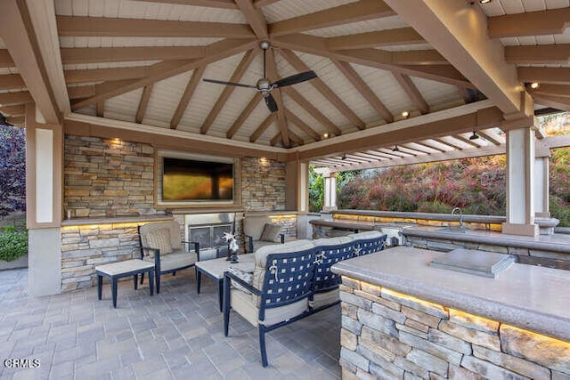 view of patio / terrace with a gazebo, area for grilling, and ceiling fan