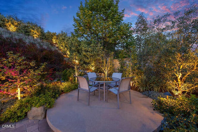 patio terrace at dusk with outdoor dining space