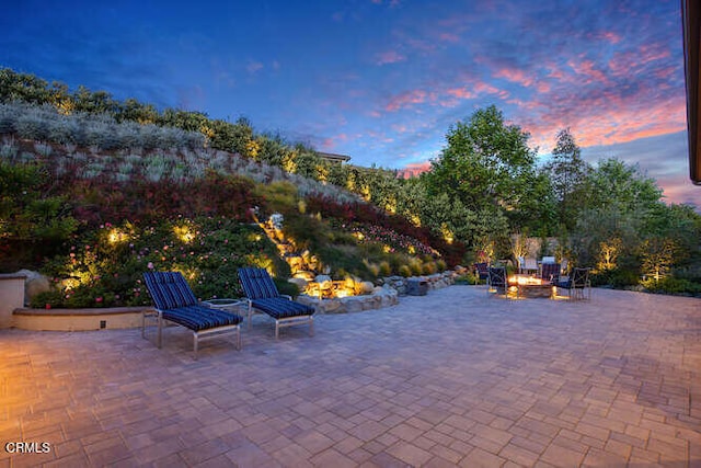 view of patio / terrace with an outdoor fire pit