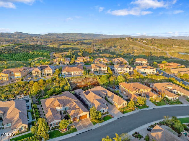 aerial perspective of suburban area featuring a mountain backdrop