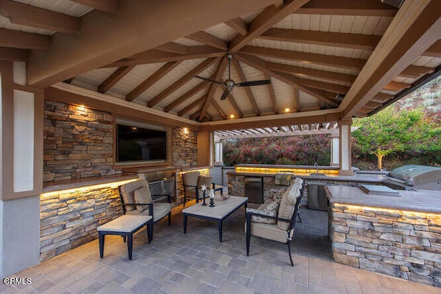 view of patio / terrace featuring a gazebo, exterior bar, area for grilling, and a grill