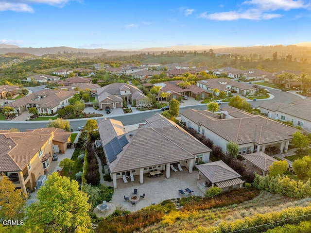 aerial perspective of suburban area with a mountainous background