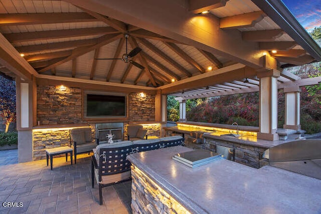 view of patio / terrace with a gazebo, area for grilling, and a sink