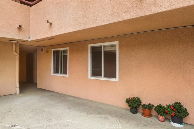view of home's exterior with a patio area and stucco siding