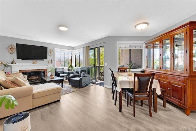 2916 Alanwood Ct, Spring Valley, CA 91978 - dining space with light wood-style floors and a fireplace