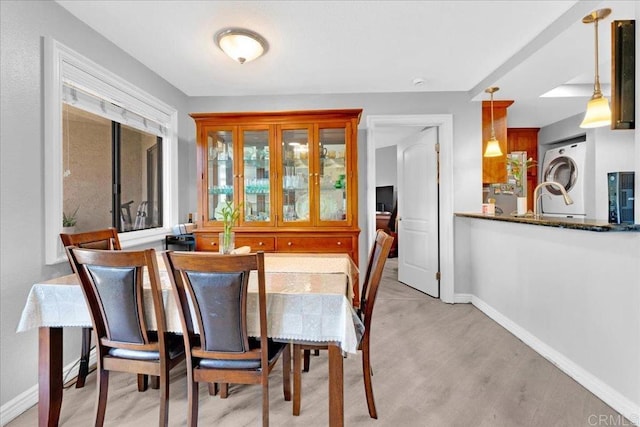 2916 Alanwood Ct, Spring Valley, CA 91978 - dining area featuring washer / dryer and light wood-style flooring