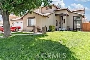 13775 Valera Way, Victorville, CA 92392 - view of front facade featuring an attached garage and stucco siding