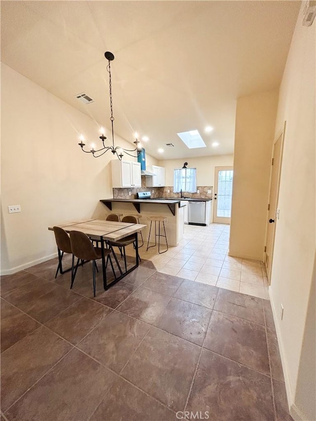 770 Cypress Ln, Blythe, CA 92225 - dining space with a chandelier, baseboards, a skylight, light tile patterned flooring, and recessed lighting