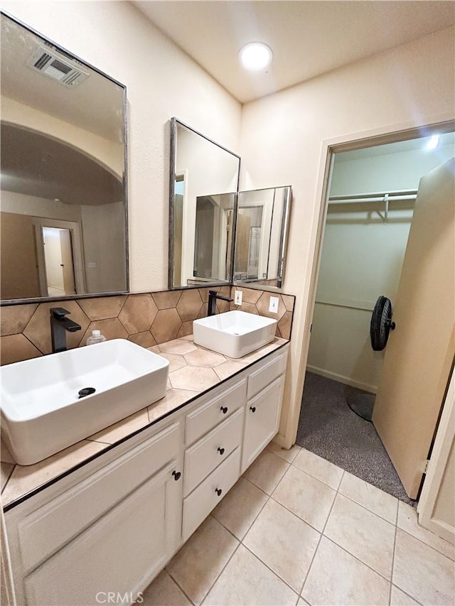 770 Cypress Ln, Blythe, CA 92225 - full bath with tile patterned flooring, tasteful backsplash, a walk in closet, and double vanity
