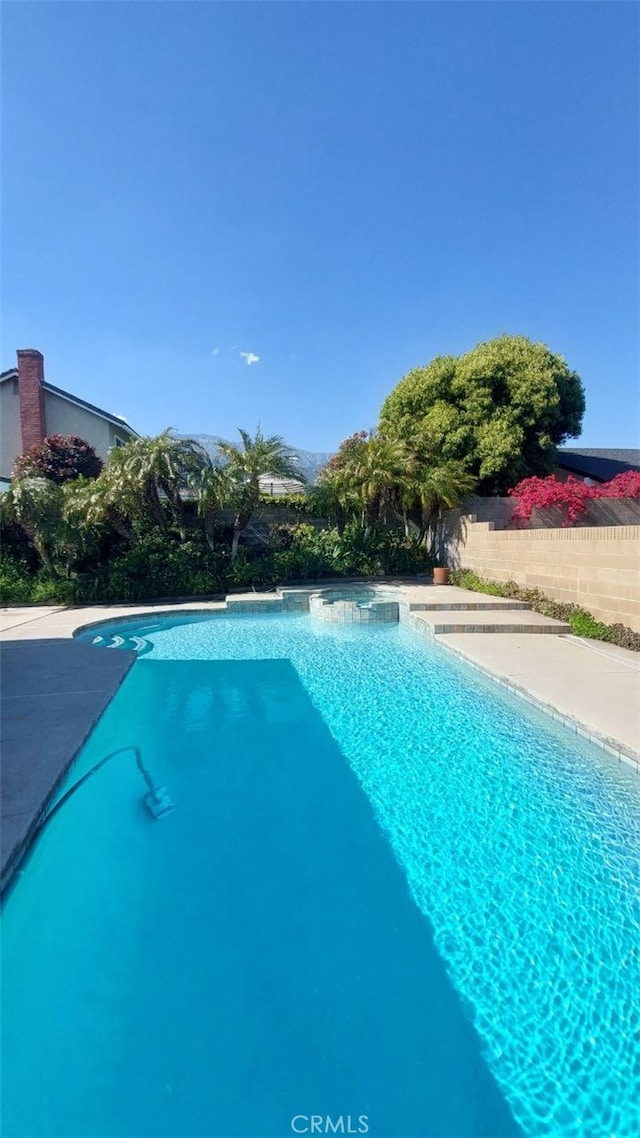 swimming pool featuring fence