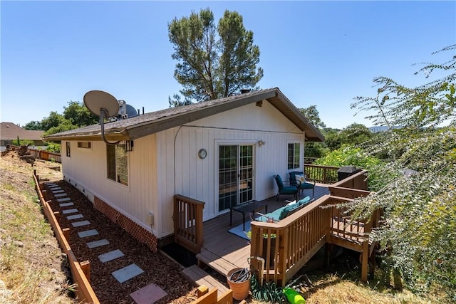 rear view of house with a deck