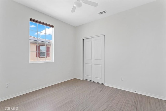 22069 Windham Way, Saugus, CA 91350 - unfurnished bedroom featuring wood finished floors, a closet, baseboards, and ceiling fan