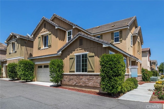 22069 Windham Way, Saugus, CA 91350 - view of front facade featuring an attached garage, a tile roof, and stucco siding