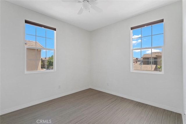 22069 Windham Way, Saugus, CA 91350 - spare room featuring baseboards, wood finished floors, and a ceiling fan