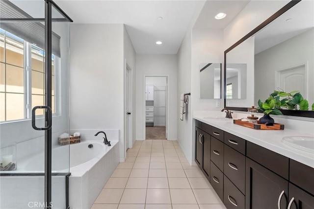 22069 Windham Way, Saugus, CA 91350 - bathroom with double vanity, a bath, tile patterned floors, and a stall shower