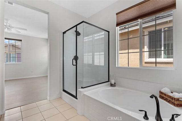22069 Windham Way, Saugus, CA 91350 - bathroom with a stall shower, a garden tub, tile patterned flooring, a ceiling fan, and baseboards