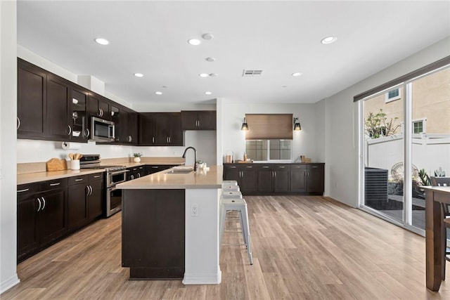 22069 Windham Way, Saugus, CA 91350 - kitchen featuring appliances with stainless steel finishes, a sink, light wood finished floors, and recessed lighting