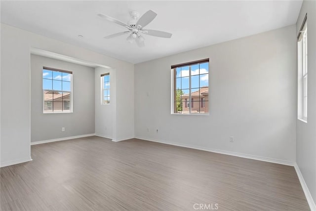 22069 Windham Way, Saugus, CA 91350 - spare room with wood finished floors, ceiling fan, and baseboards