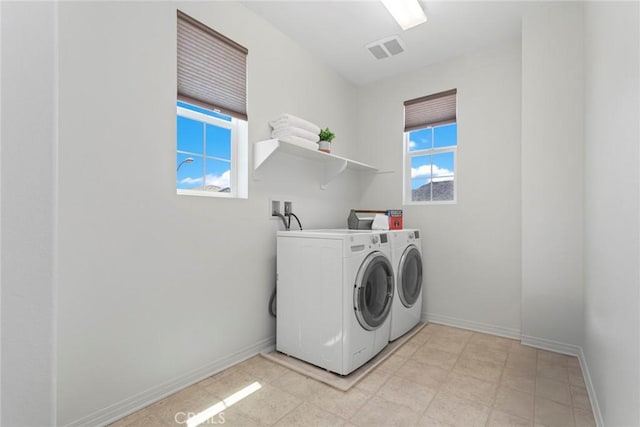 22069 Windham Way, Saugus, CA 91350 - washroom featuring separate washer and dryer, plenty of natural light, and baseboards