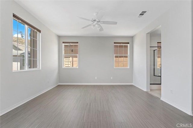 22069 Windham Way, Saugus, CA 91350 - empty room featuring wood finished floors, ceiling fan, and baseboards