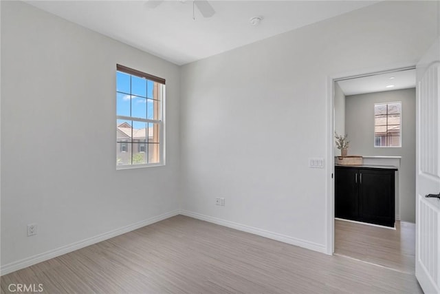 22069 Windham Way, Saugus, CA 91350 - unfurnished room featuring a ceiling fan, light wood-style flooring, plenty of natural light, and baseboards