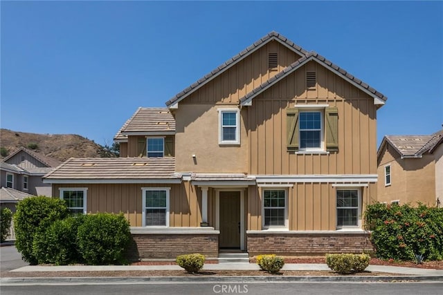 22069 Windham Way, Saugus, CA 91350 - view of front facade with board and batten siding and a tile roof