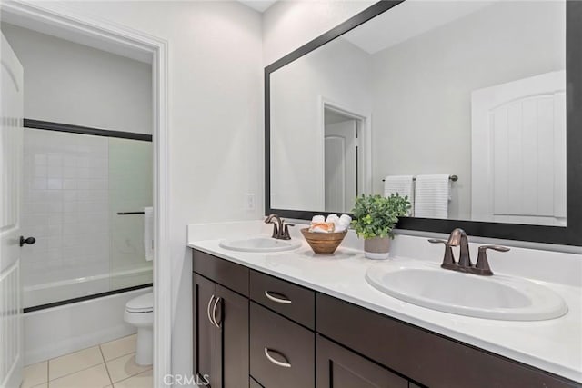 22069 Windham Way, Saugus, CA 91350 - bathroom with double vanity, toilet, tile patterned flooring, and enclosed tub / shower combo