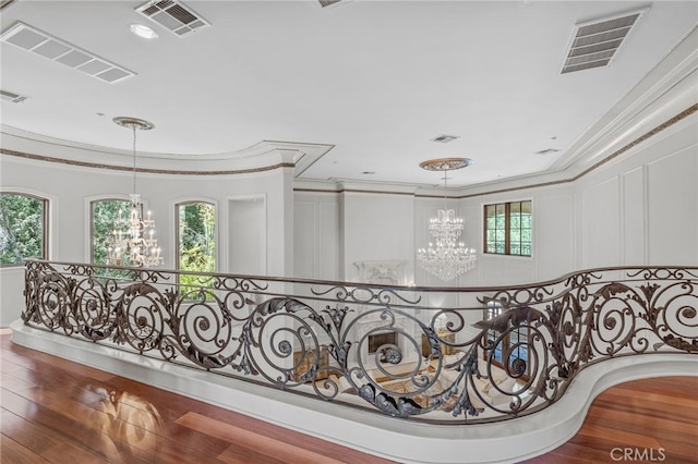328 N Terrace View Dr, Monrovia, CA 91016 - corridor with a chandelier, crown molding, healthy amount of natural light, an upstairs landing, and wood finished floors