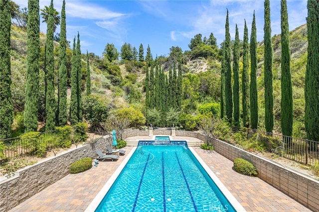 328 N Terrace View Dr, Monrovia, CA 91016 - view of swimming pool featuring fence, a patio, and a pool with connected hot tub
