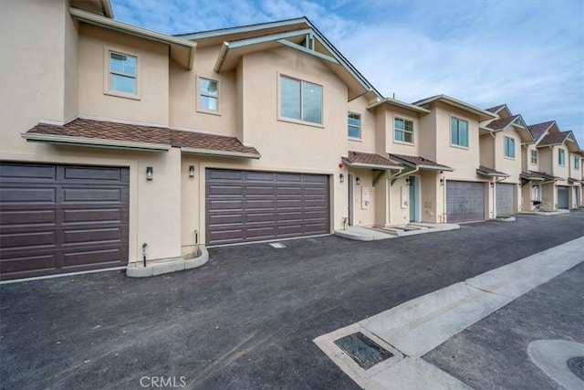 360 S Halcyon Rd, Arroyo Grande, CA 93420 - townhome / multi-family property with stucco siding, a garage, and a residential view