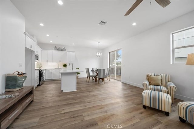 360 S Halcyon Rd, Arroyo Grande, CA 93420 - kitchen with stainless steel appliances, light countertops, ceiling fan, white cabinets, and recessed lighting