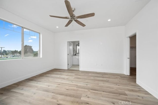 360 S Halcyon Rd, Arroyo Grande, CA 93420 - unfurnished bedroom featuring light wood-style flooring, ensuite bath, a spacious closet, recessed lighting, and a ceiling fan
