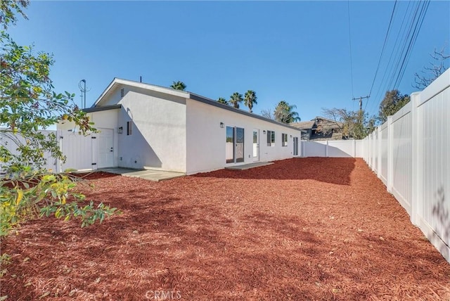16938 Bell Ave, Lake Elsinore, CA 92530 - back of property with a fenced backyard and stucco siding