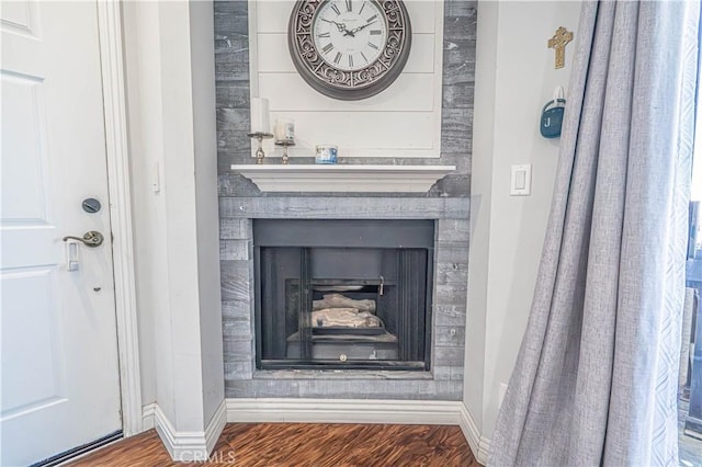18111 Erik Ct Unit 445, Canyon Country, CA 91387 - detailed view of baseboards, a large fireplace, and wood finished floors