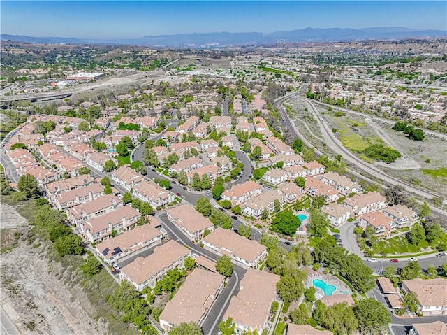 18111 Erik Ct Unit 445, Canyon Country, CA 91387 - aerial overview of property's location with nearby suburban area, a mountain backdrop, and a pool area